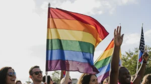 Rainbow Pride Flag waving at a Pride parade in the USA, symbolizing LGBTQ+ community and inclusivity
